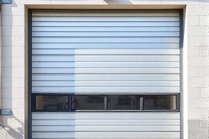 A modern metal garage door with sleek horizontal panels, sturdy frame, and industrial design, shown in a realistic setting with natural lighting, detailed textures, and a clean background