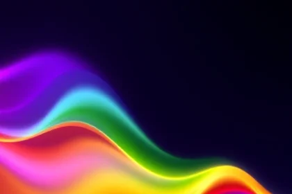 A vibrant, abstract spectrum of colors flowing like liquid light across a dark background, with smooth gradients transitioning from deep violet to electric blue, bright green, warm yellow, and fiery red, forming a dynamic, flowing wave pattern that suggests energy and possibility, no text, no symbols, no recognizable objects, purely chromatic and fluid